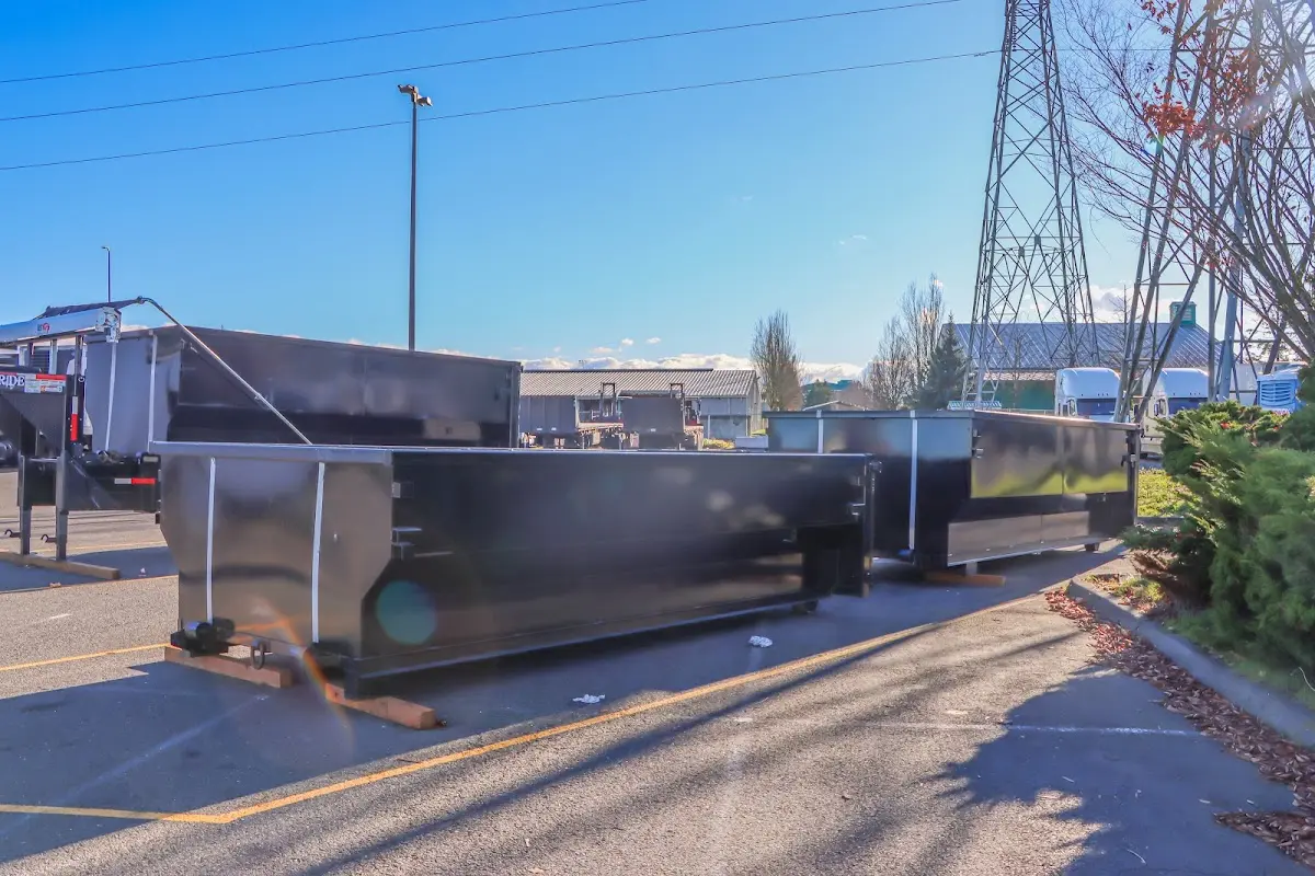 Roll-off dumpster ready for waste disposal at job site for Concrete Dumpster Rental in Conway